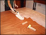 y23-rollering one the white pigmented epoxy.JPG